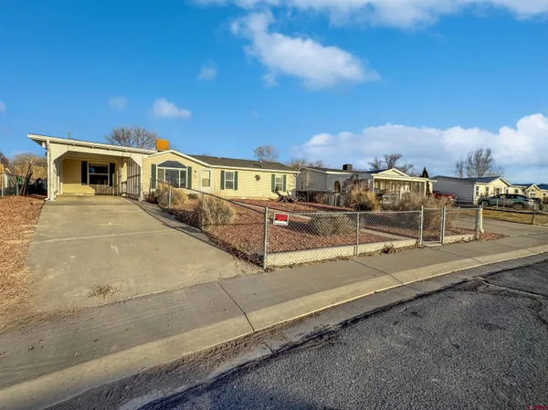 a view of a house with a street