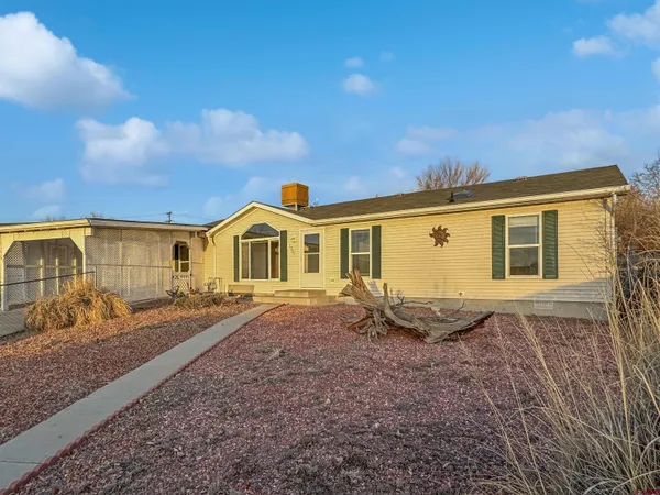 a front view of a house with yard