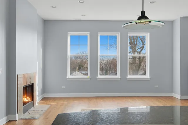 a spacious bedroom with a bed and a window