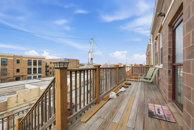 a view of a balcony with wooden floor