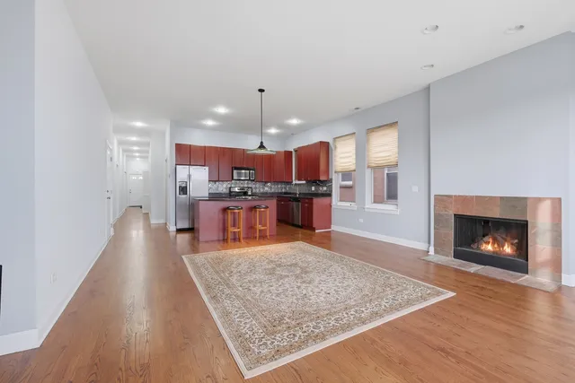 a kitchen with stainless steel appliances granite countertop wooden cabinets stove top oven and sink