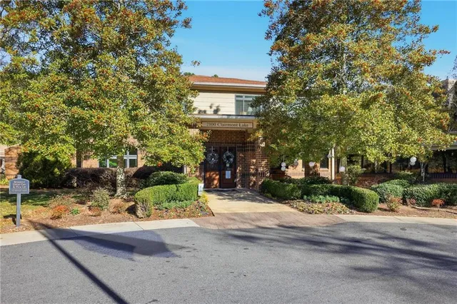 a front view of a house with a yard and a garage