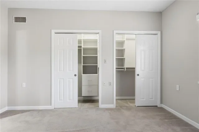 a bathroom with a bath tub with a shower