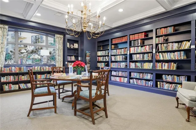 a living room with furniture a window and a fireplace