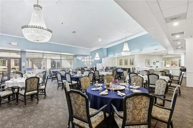a backyard of a house with yard table and chairs