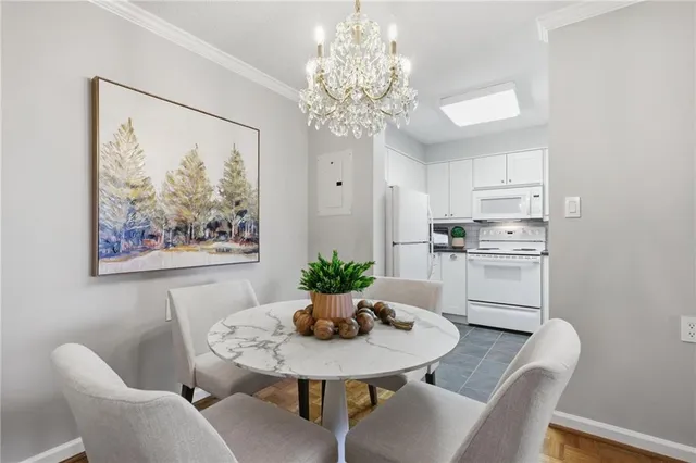 a living room with furniture potted plant and a window