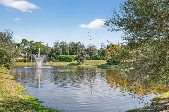 a wooden bench sitting on top of a wooden floor