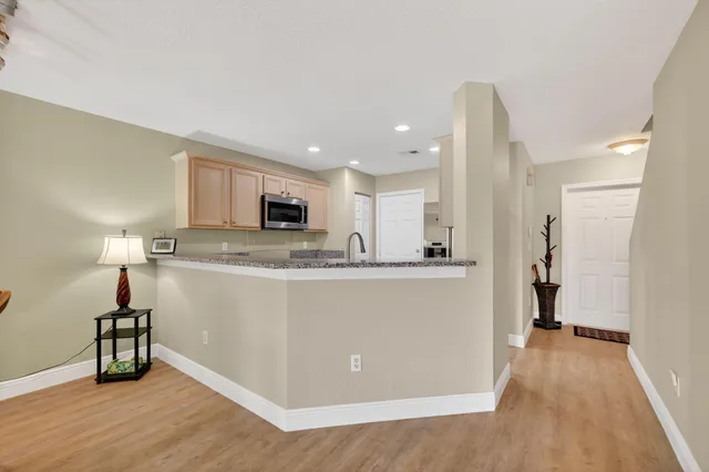 a bathroom with a sink toilet double vanity and shower