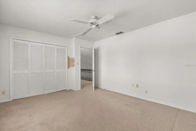 a room with pool table and windows