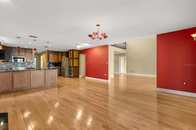 a large kitchen with stainless steel appliances granite countertop a large kitchen counter top a oven and a sink