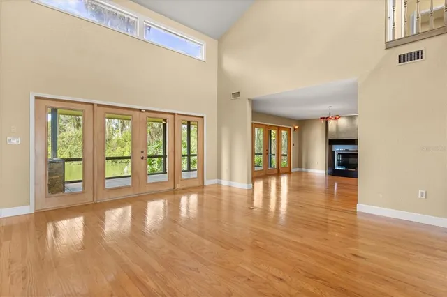 a view of an entryway with wooden floor