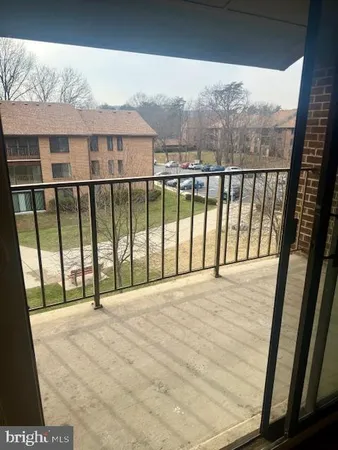 a view of a room with furniture and window