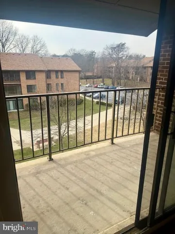 a view of a room with furniture and window