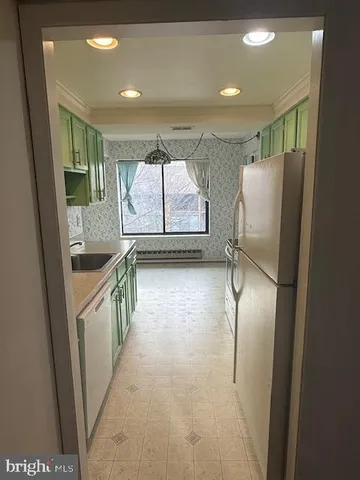 a utility room with a sink a washer and dryer