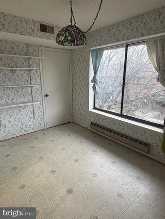 a bathroom with sink toilet and a mirror