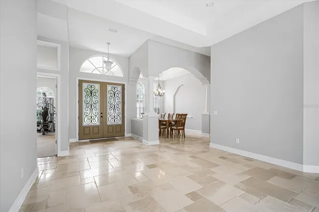 a view of a livingroom with furniture and a window