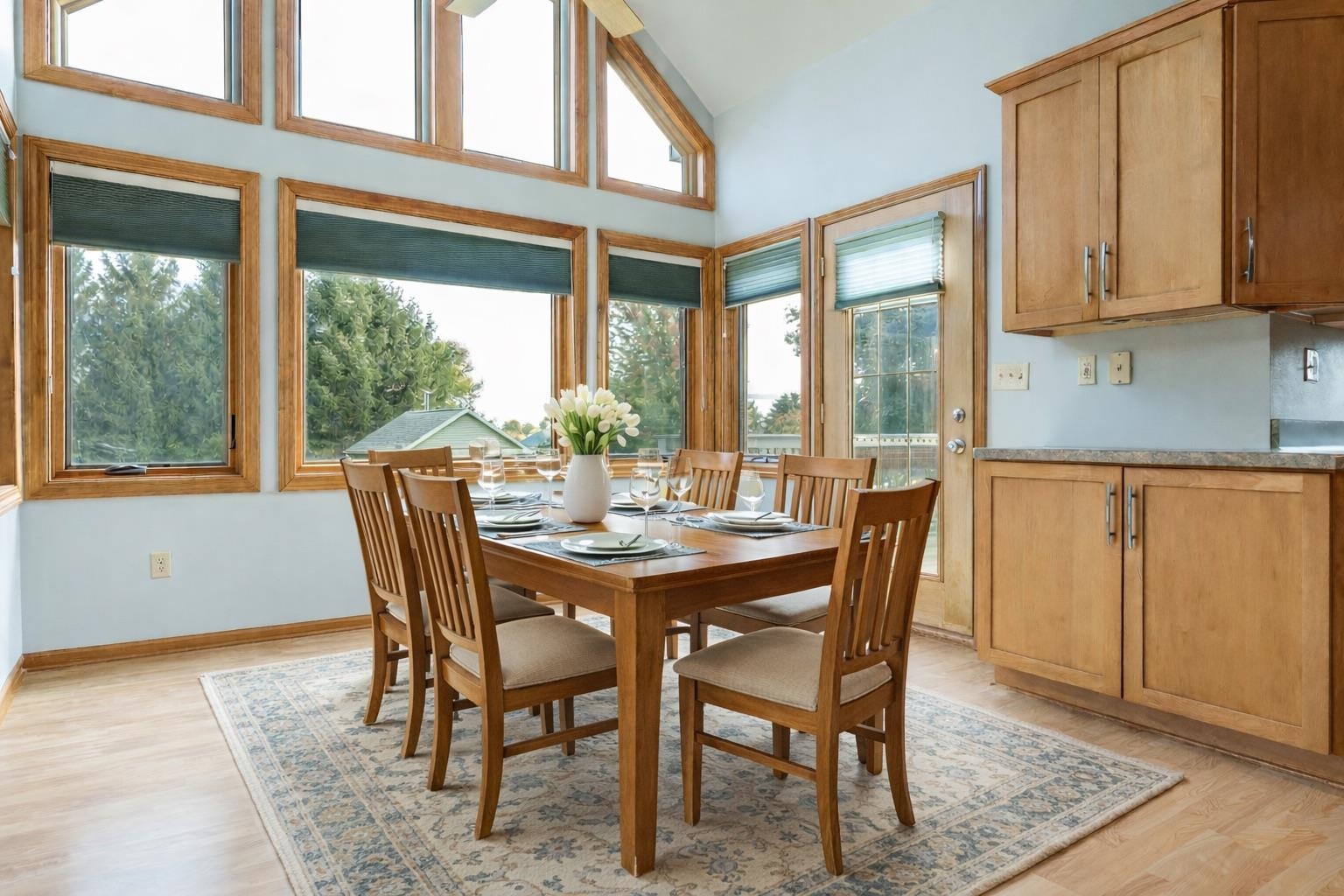 a view of a dining room with furniture window and outside view