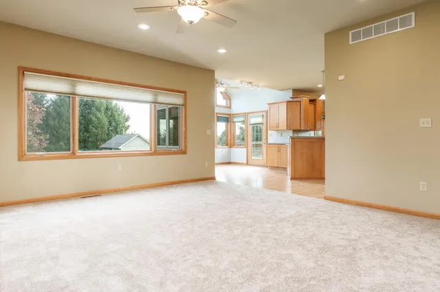 a kitchen with stainless steel appliances granite countertop a sink a stove top oven a counter space and cabinets