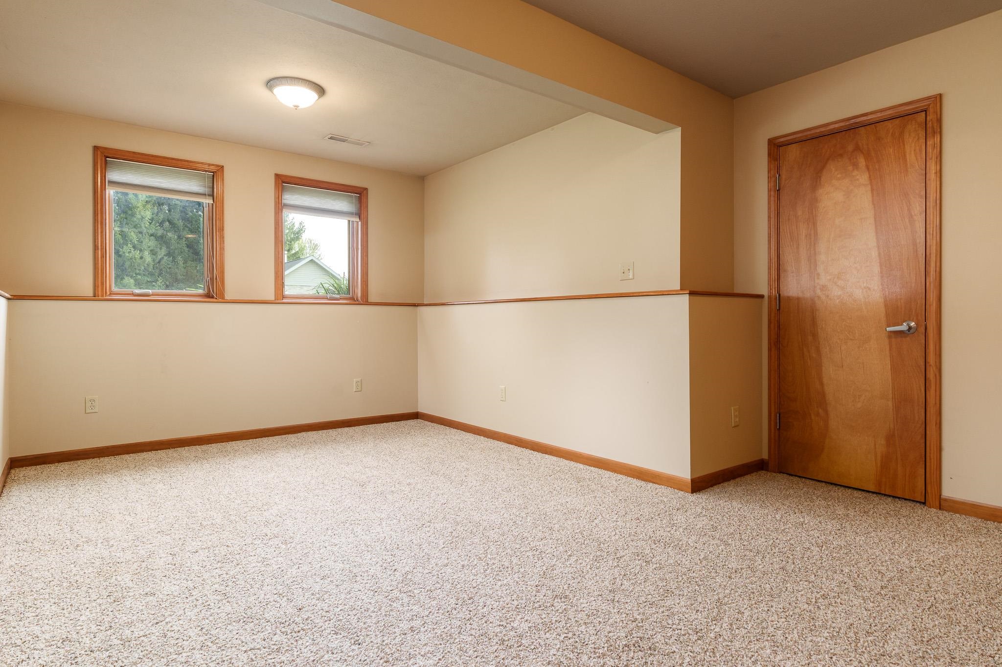 12859 Prairie Meadow Way Belvidere, IL 61008 - Photo 23 of 67 an empty room with windows and refrigerator