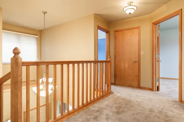 a white bath tub sitting in a bathroom next to a window