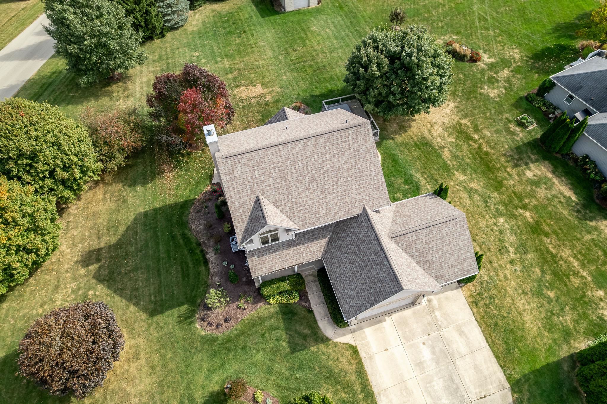 12859 Prairie Meadow Way Belvidere, IL 61008 - Photo 31 of 67 an aerial view of a house with a yard and lake view