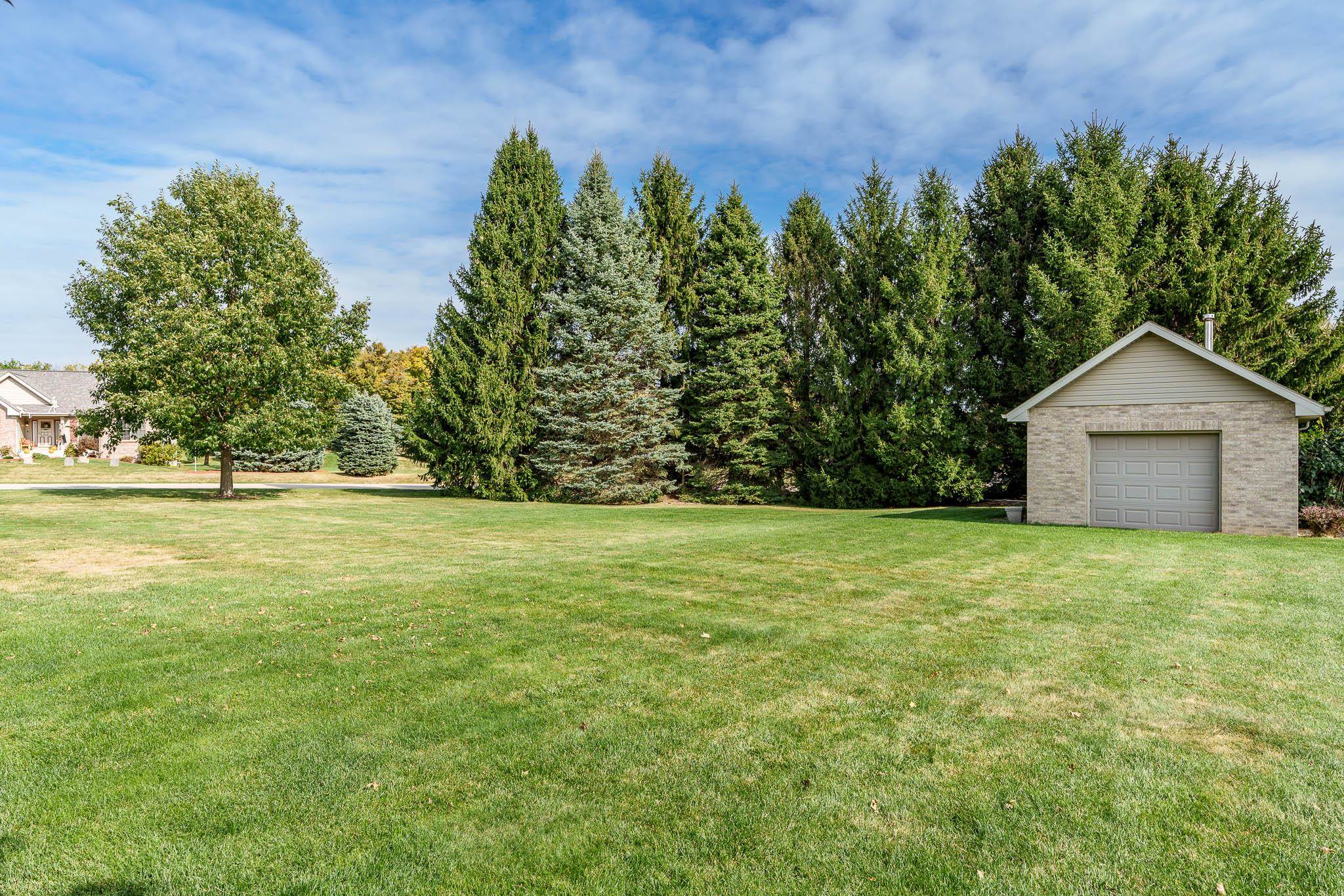 12859 Prairie Meadow Way Belvidere, IL 61008 - Photo 32 of 67 a house with trees in front of it