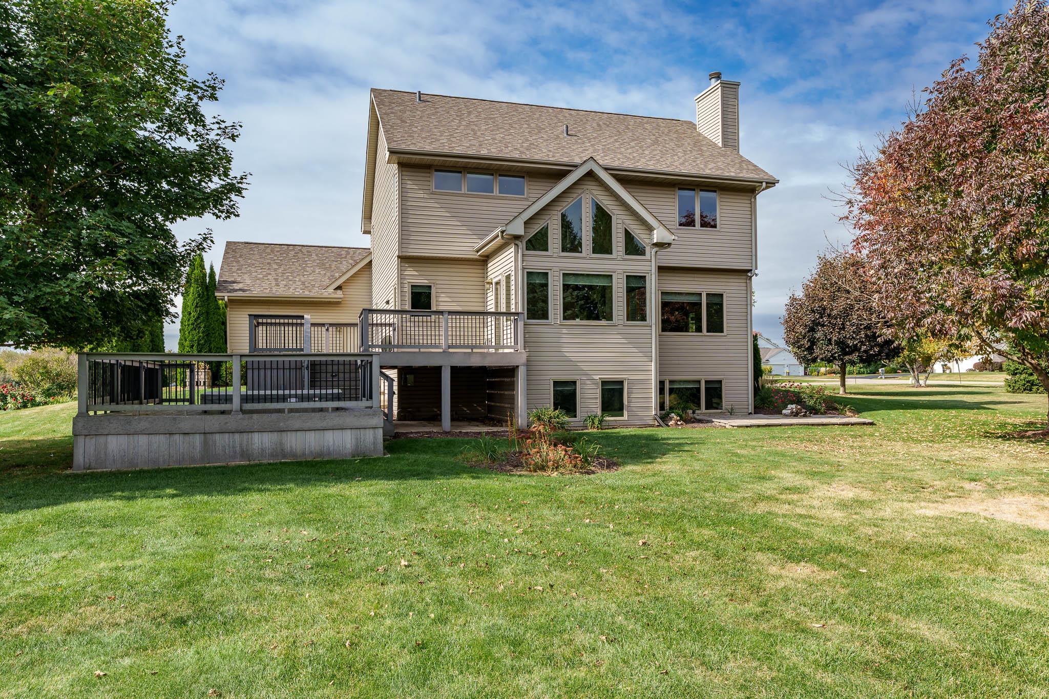 12859 Prairie Meadow Way Belvidere, IL 61008 - Photo 40 of 67 a front view of a house with a yard