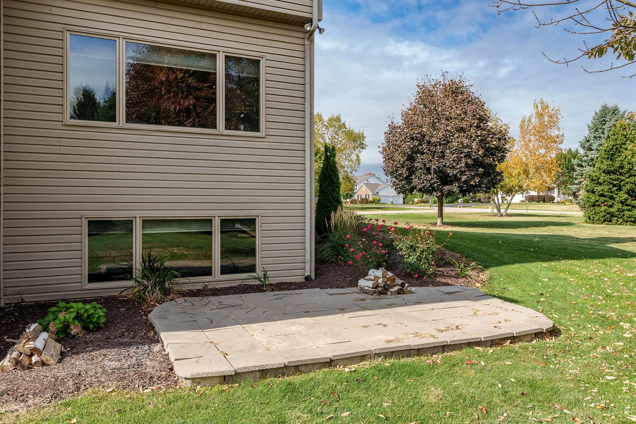 12859 Prairie Meadow Way Belvidere, IL 61008 - Photo 46 of 67 a view of a house with backyard and sitting area