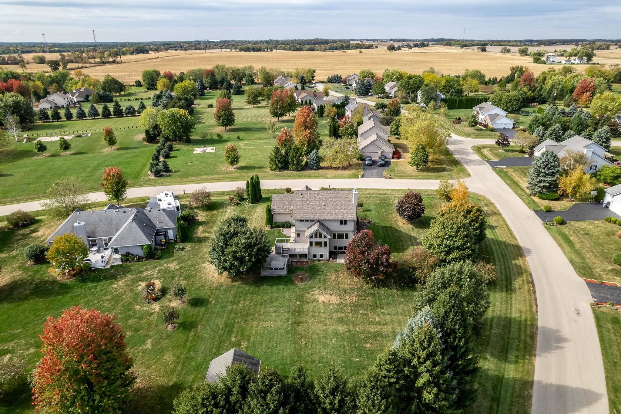 12859 Prairie Meadow Way Belvidere, IL 61008 - Photo 63 of 67 an aerial view of ocean with residential houses with outdoor space and trees