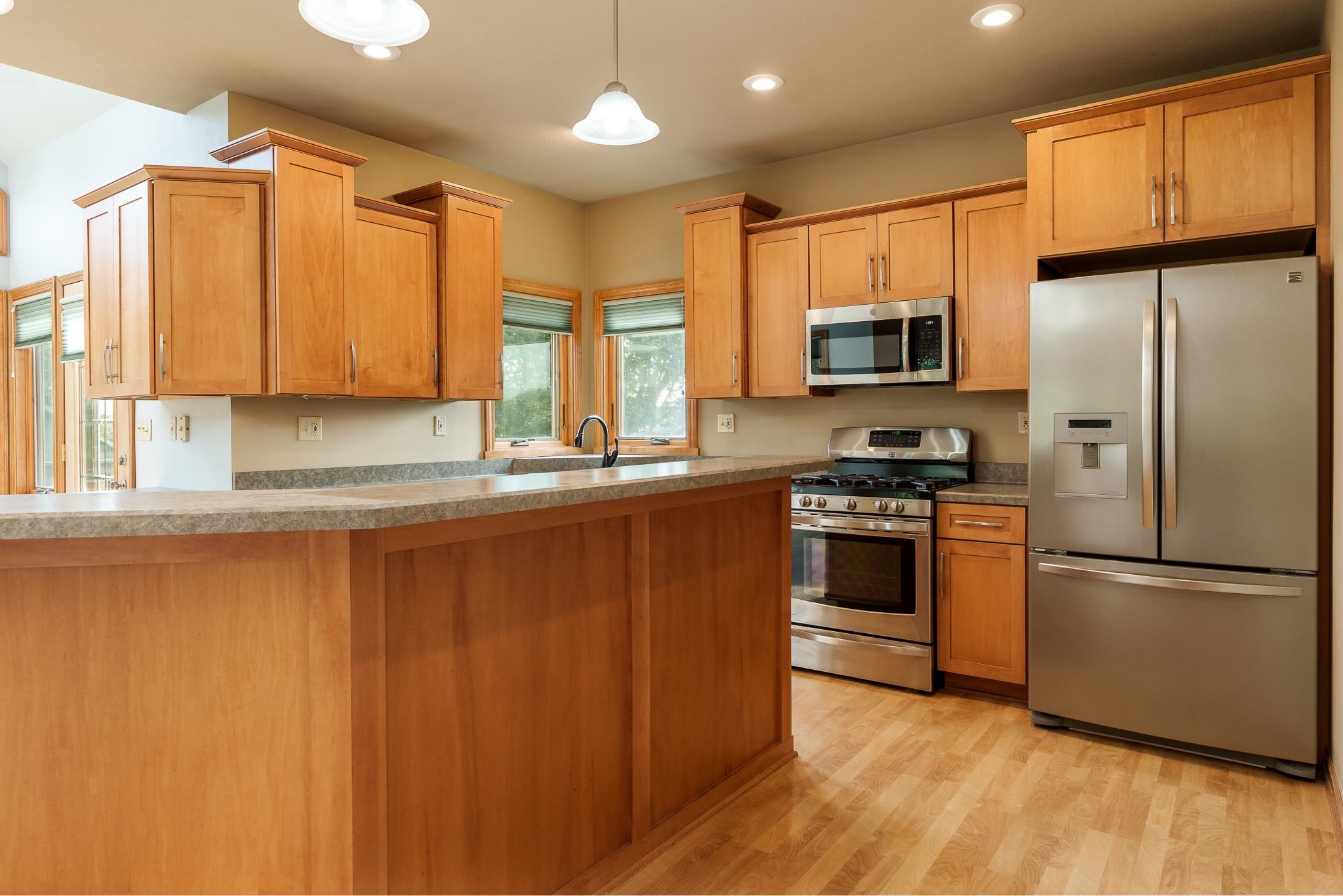 12859 Prairie Meadow Way Belvidere, IL 61008 - Photo 65 of 67 a kitchen with stainless steel appliances granite countertop a refrigerator a sink and a stove