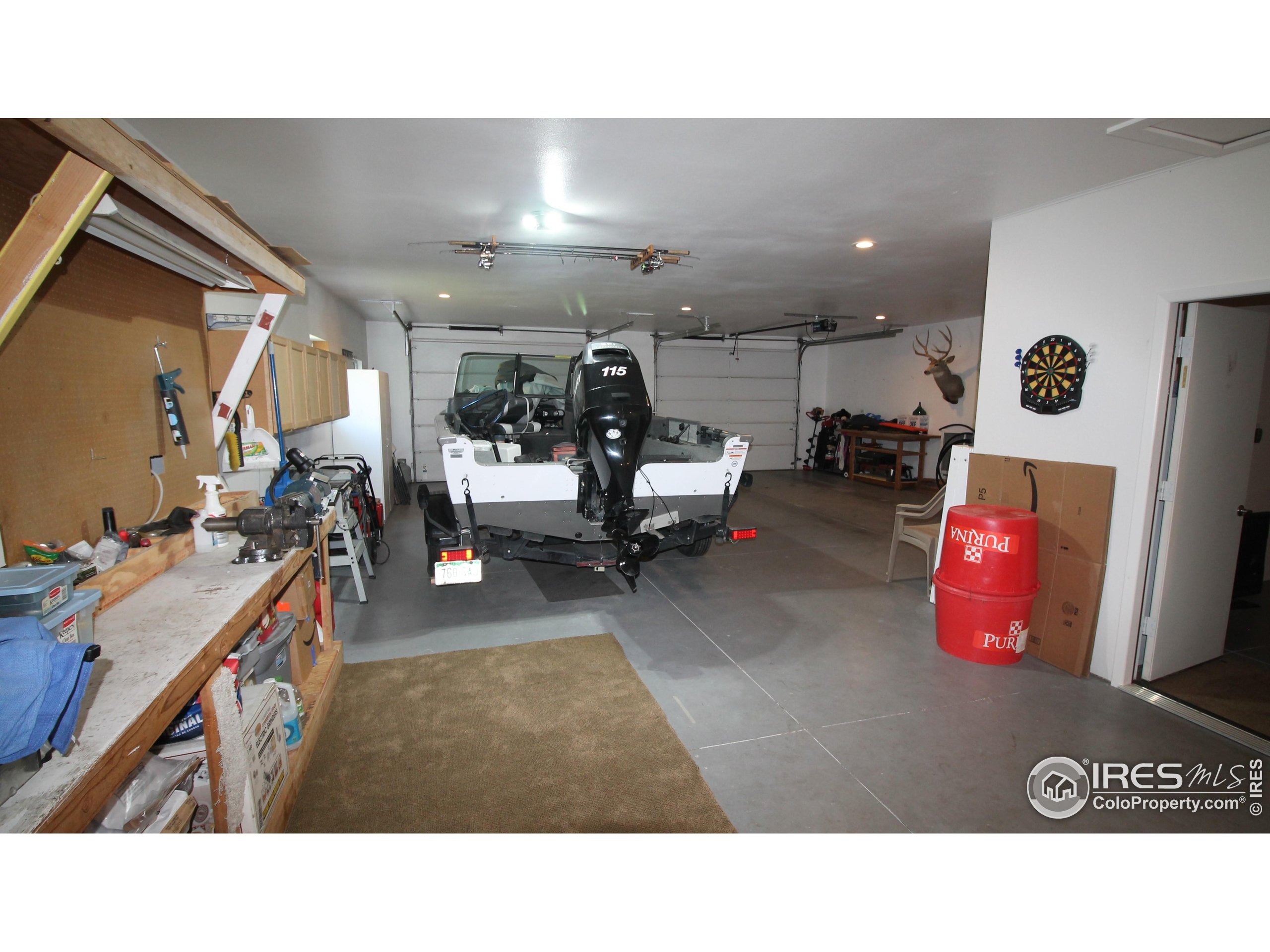 14363 Dakota Road Sterling, CO 80751 - Photo 29 of 40 a room with gym equipment and a view of living room