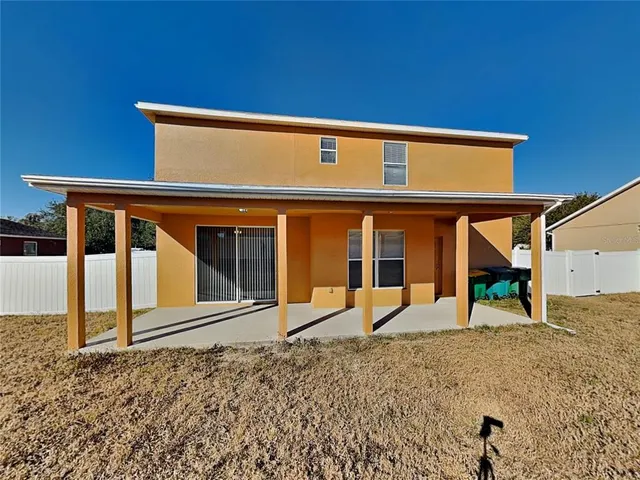 a view of a house with large windows