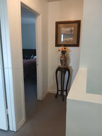a view of a hallway with workspace