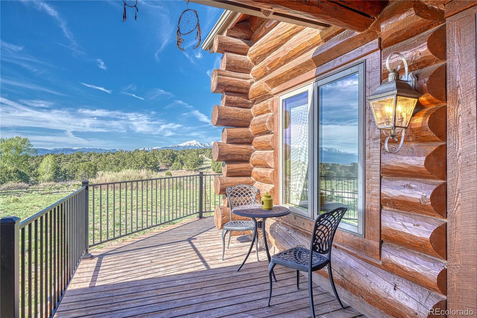 12098 County Road Salida, CO 81201 - Photo 12 of 49 a view of a balcony with furniture and wooden floor