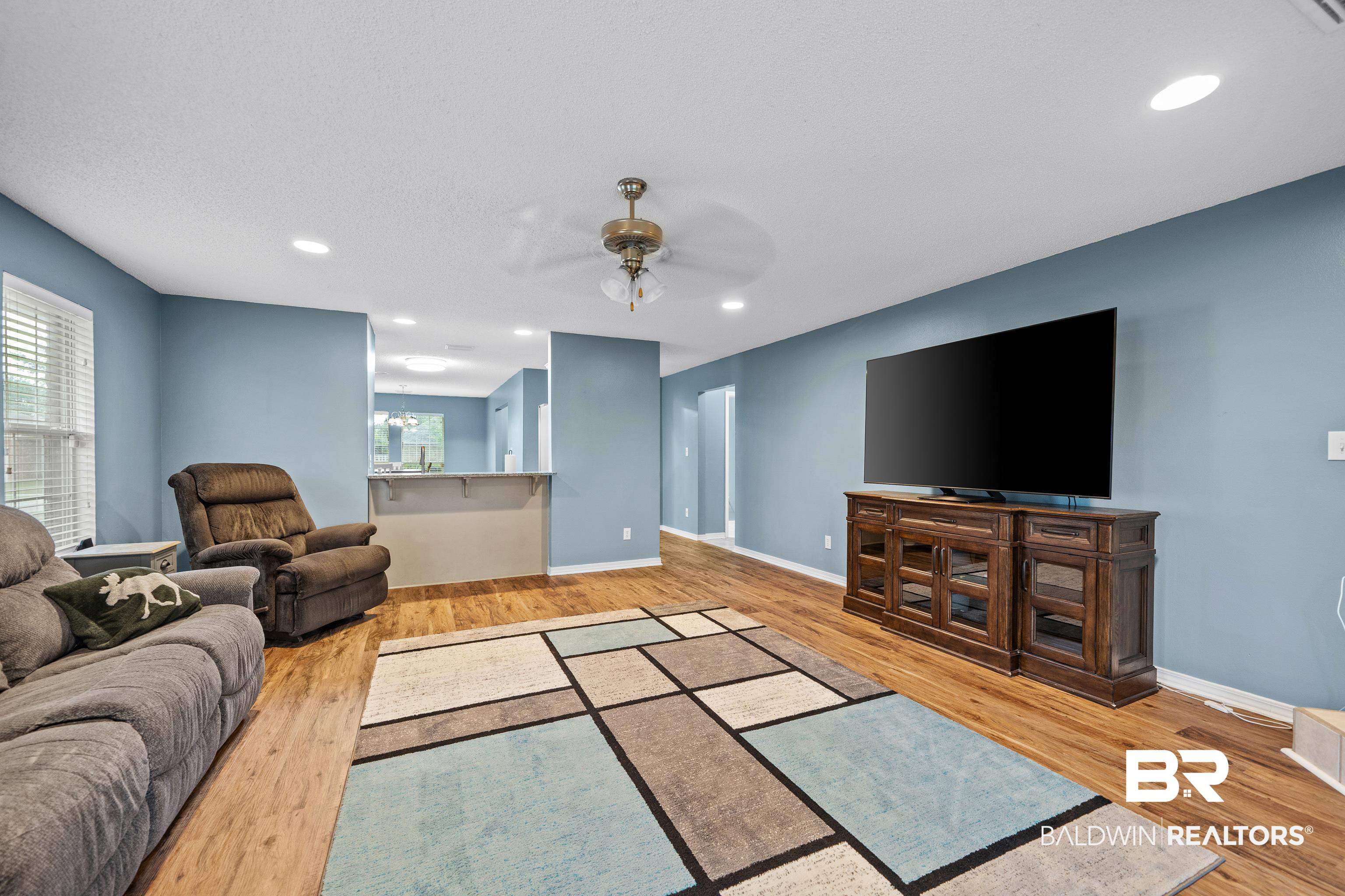 9552 Collier Loop Daphne, AL 36526 - Photo 14 of 28 Living room featuring ceiling fan, wood finished floors, baseboards, and recessed lighting