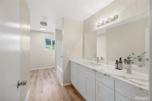 a bathroom with a sink and mirror