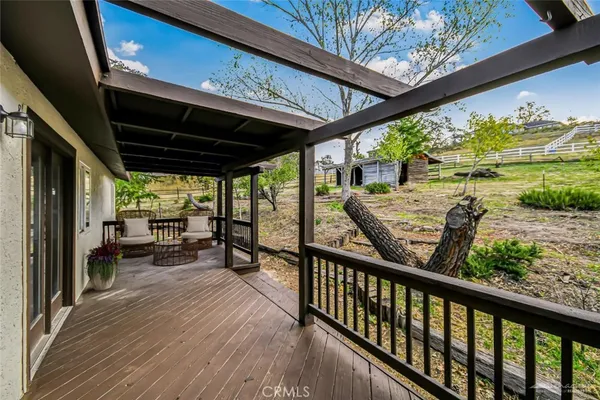 a view of a two chairs in the balcony