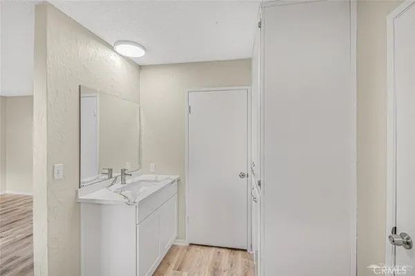 a bathroom with a sink a mirror and a shower