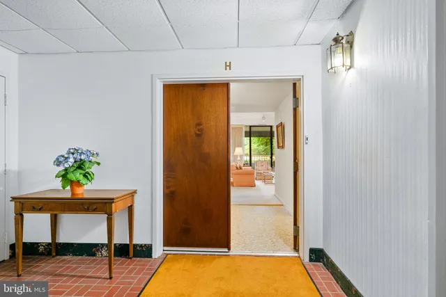 a view of an entryway with table and door