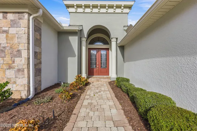 a view of an entryway with wooden floor