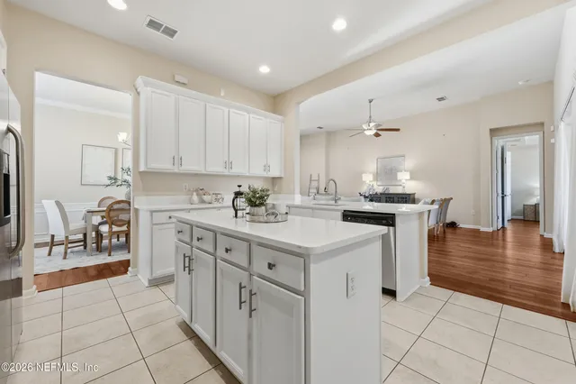 a bedroom with a large bed and a large window