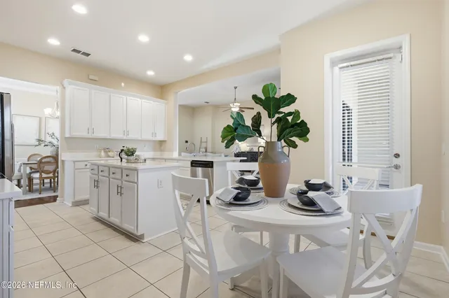 a bathroom with a sink vanity and a mirror