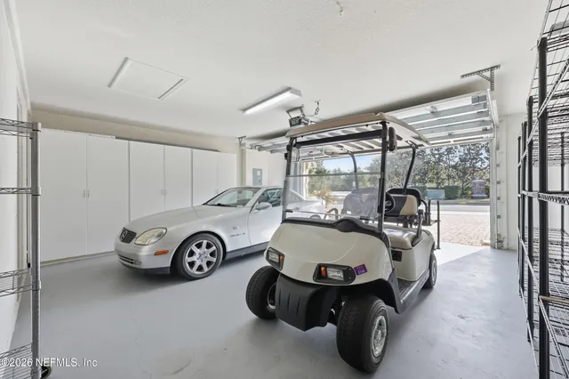 a view of a house with swimming pool and a chairs
