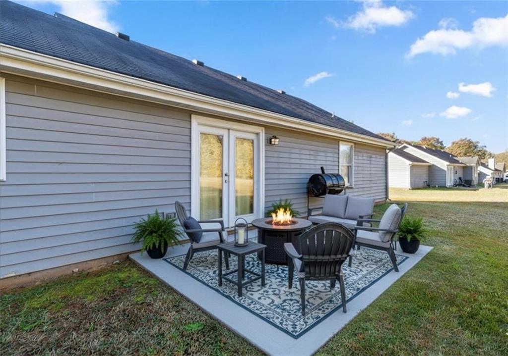 472 Oak Hill Road Covington, GA 30016 - Photo 26 of 41 a view of a house with backyard sitting area and garden