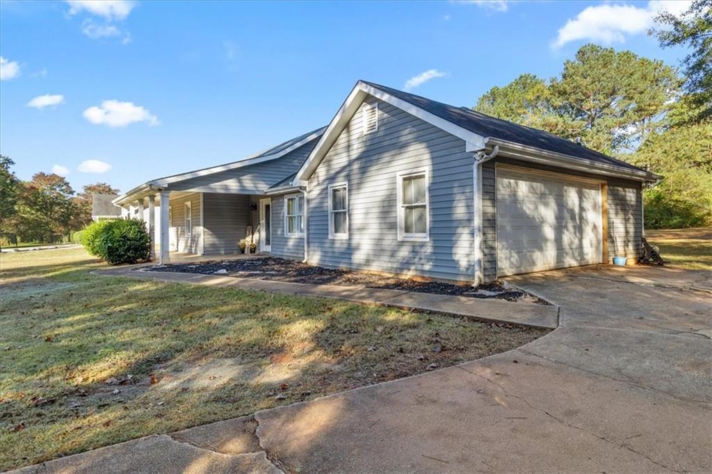 472 Oak Hill Road Covington, GA 30016 - Photo 34 of 41 a view of a house with backyard and sitting area