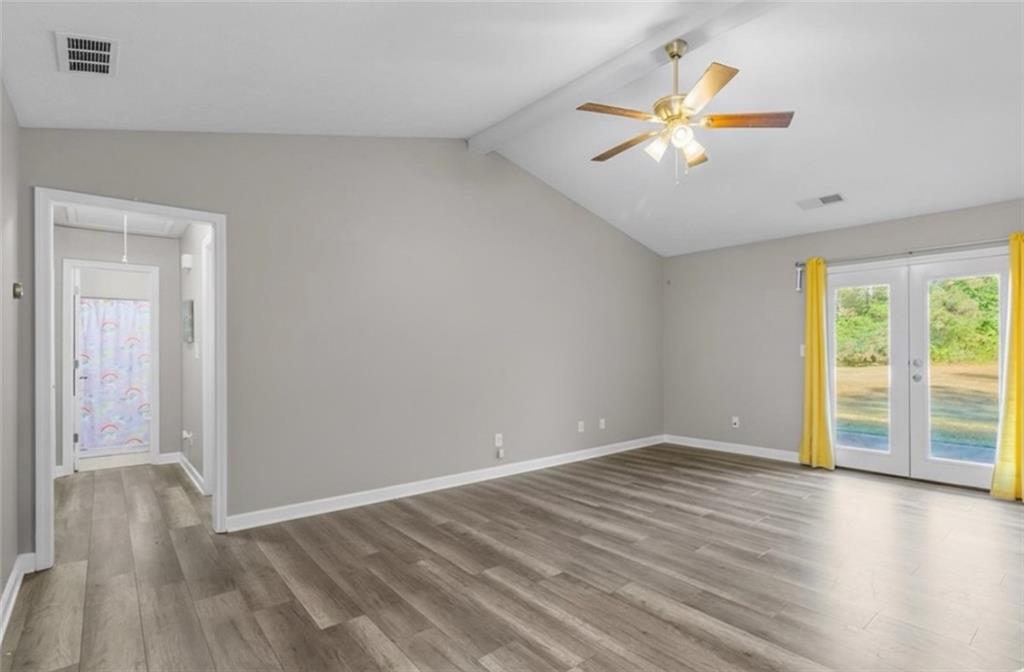 472 Oak Hill Road Covington, GA 30016 - Photo 7 of 41 wooden floor in an empty room with a window
