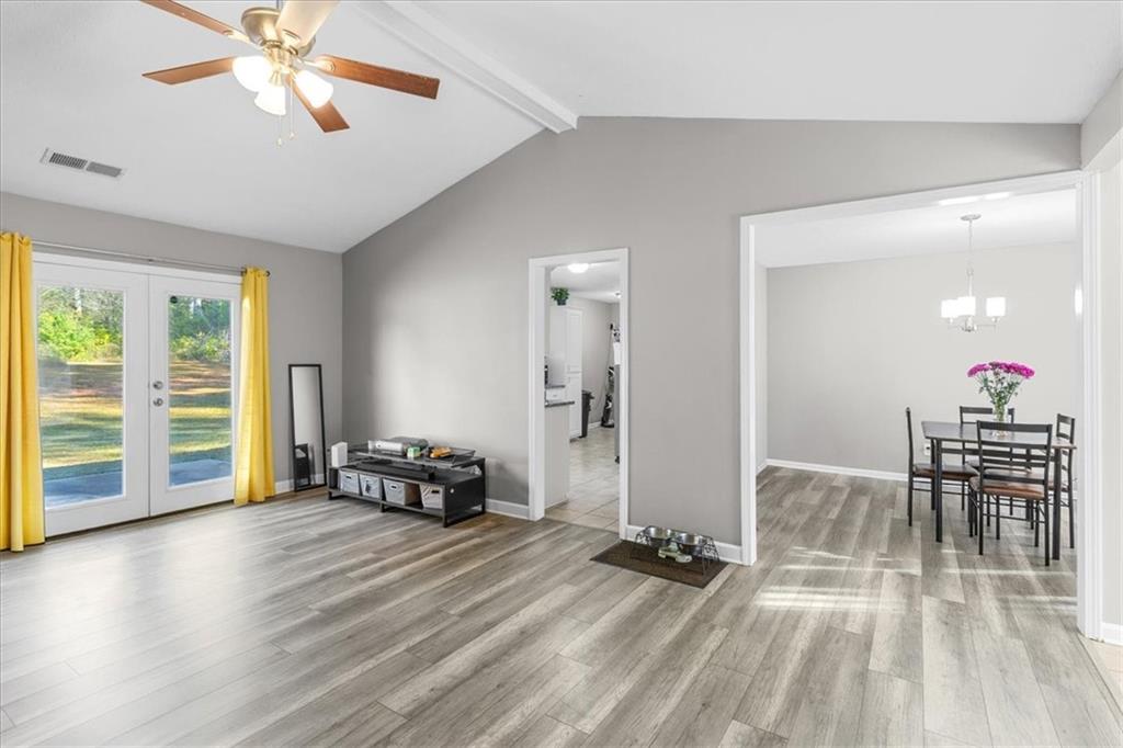 472 Oak Hill Road Covington, GA 30016 - Photo 8 of 41 a view of a dining room with furniture window and wooden floor