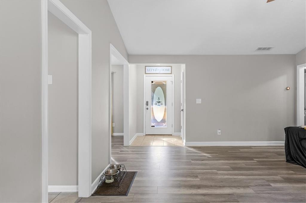 472 Oak Hill Road Covington, GA 30016 - Photo 9 of 41 a view of a hallway with wooden floor
