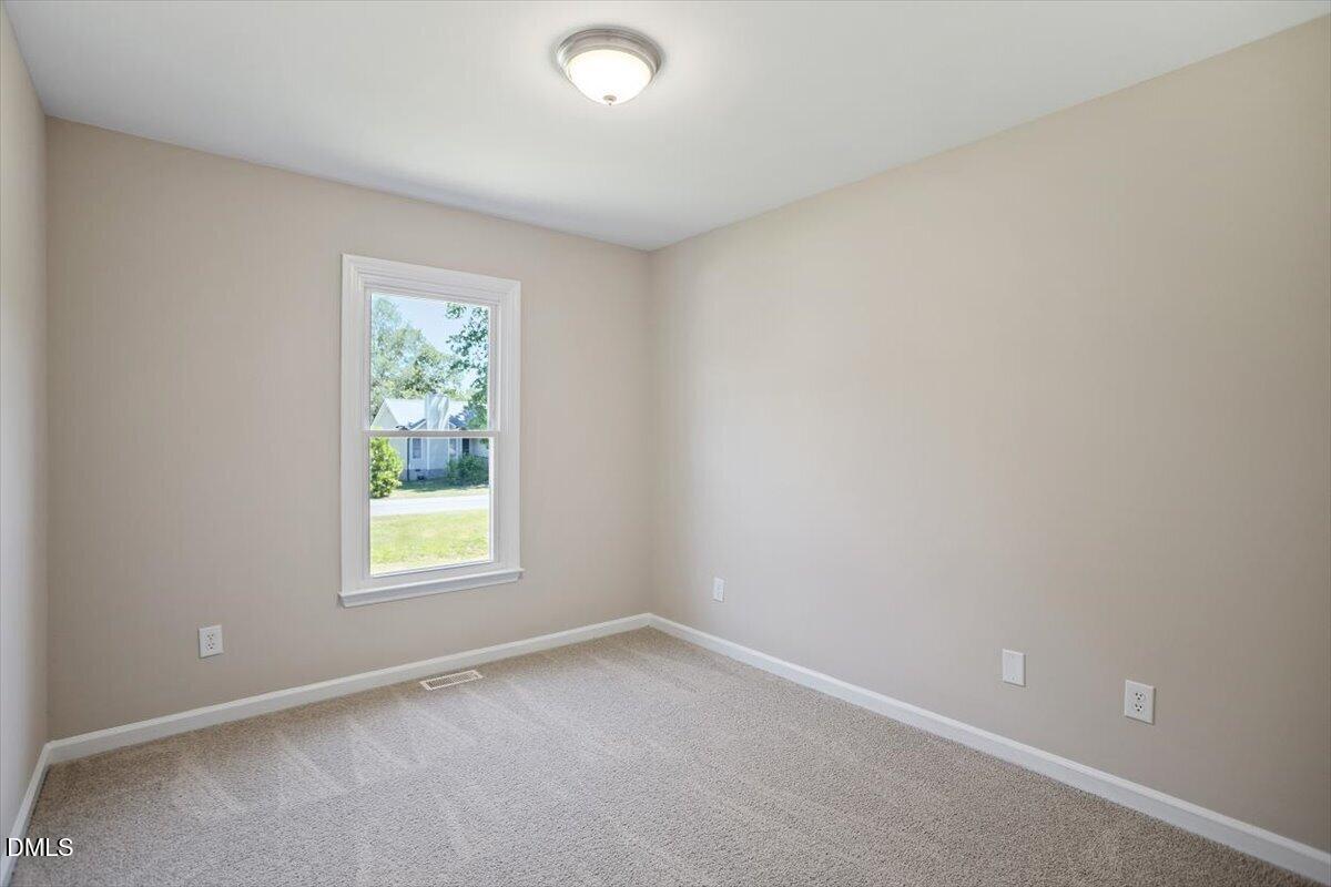 31 Fieldview Court Angier, NC 27501 - Photo 21 of 25 an empty room with a window
