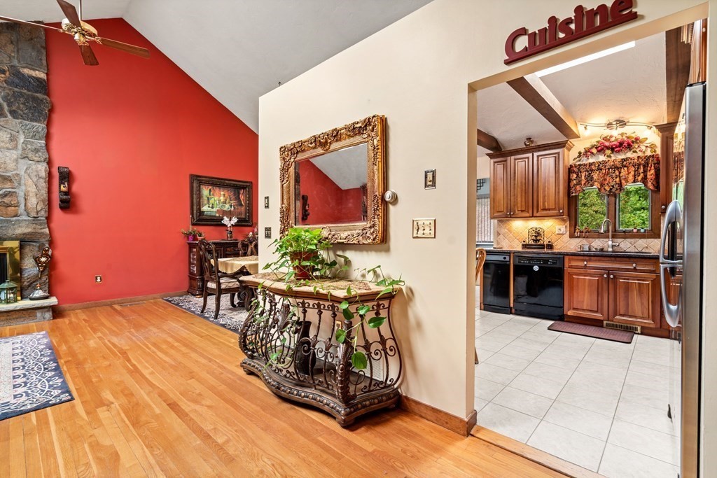3 Macone Circle Stoneham, MA 02180 - Photo 11 of 26 a view of a kitchen with kitchen island dining table and stainless steel appliances
